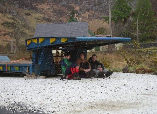 taking shelter under a trailer